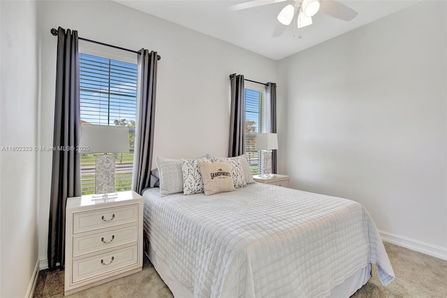 5474 S Sterling Ranch Cir, Davie, FL 33314 - bedroom with light carpet, baseboards, and a ceiling fan