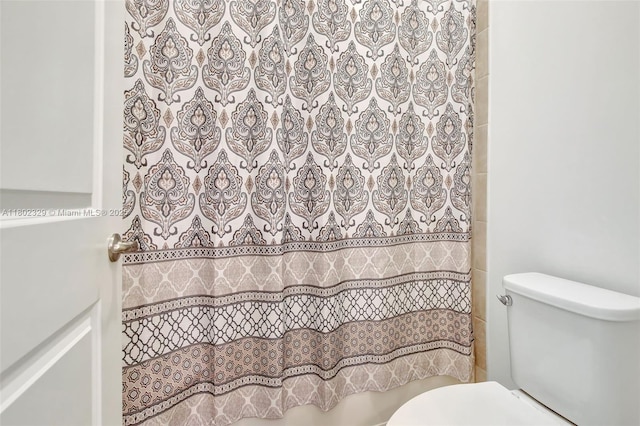 5474 S Sterling Ranch Cir, Davie, FL 33314 - bathroom with toilet and a shower with shower curtain