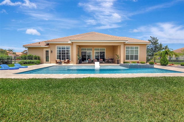 5474 S Sterling Ranch Cir, Davie, FL 33314 - back of house with stucco siding, outdoor lounge area, a tile roof, and a lawn