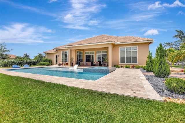 5474 S Sterling Ranch Cir, Davie, FL 33314 - back of property featuring stucco siding, a yard, a patio, a tiled roof, and a pool with connected hot tub