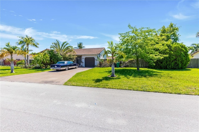 22041 SW 127th Ct, Miami, FL 33170 - view of property hidden behind natural elements featuring asphalt driveway and an attached garage