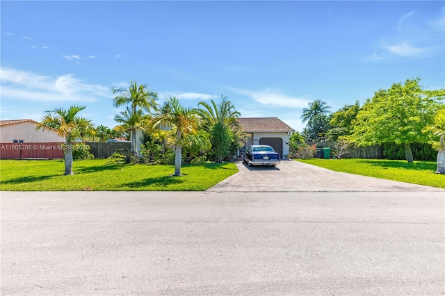 22041 SW 127th Ct, Miami, FL 33170 - view of property hidden behind natural elements with driveway and a garage