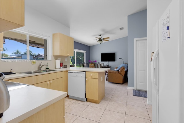 22041 SW 127th Ct, Miami, FL 33170 - kitchen featuring white appliances, light brown cabinets, a peninsula, and a sink
