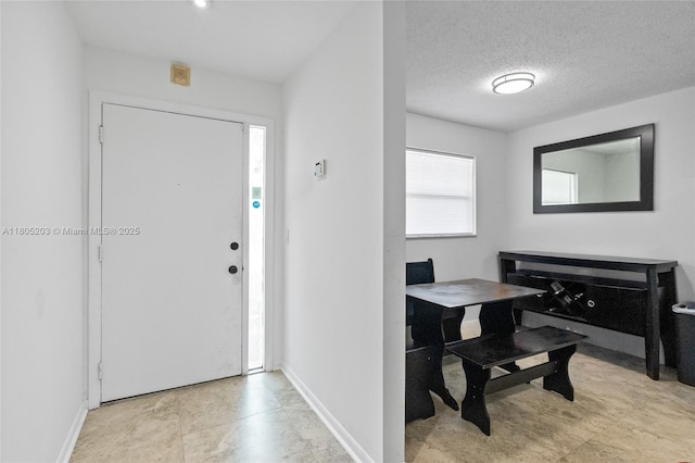 10772 La Placida Dr Unit 7-203, Coral Springs, FL 33065 - foyer entrance with baseboards and a textured ceiling