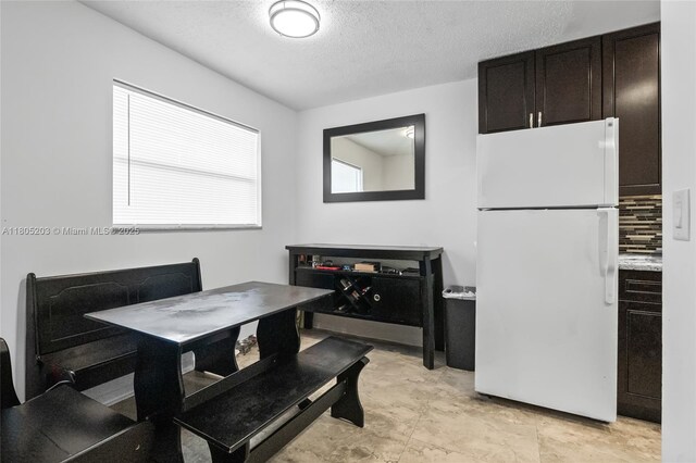 10772 La Placida Dr Unit 7-203, Coral Springs, FL 33065 - dining area with a textured ceiling