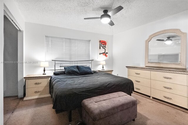 10772 La Placida Dr Unit 7-203, Coral Springs, FL 33065 - bedroom with carpet flooring, a textured ceiling, and a ceiling fan