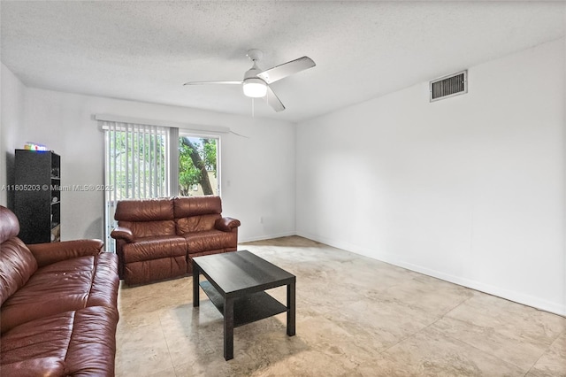 10772 La Placida Dr Unit 7-203, Coral Springs, FL 33065 - living room featuring a ceiling fan and a textured ceiling