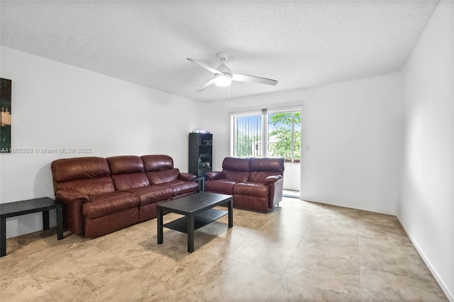10772 La Placida Dr Unit 7-203, Coral Springs, FL 33065 - living room featuring ceiling fan and a textured ceiling