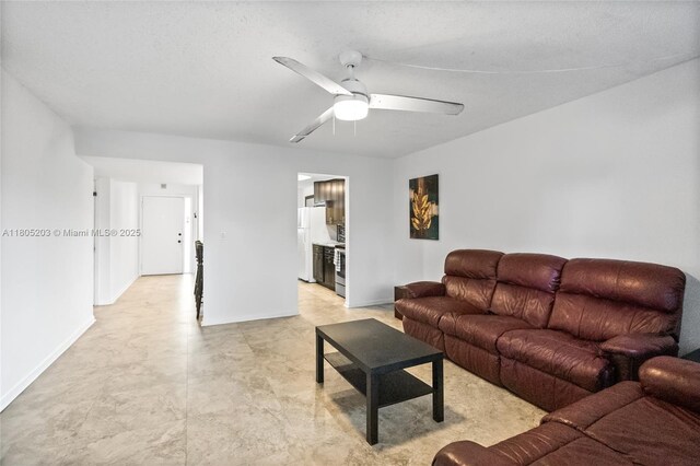 10772 La Placida Dr Unit 7-203, Coral Springs, FL 33065 - living room featuring a ceiling fan and baseboards
