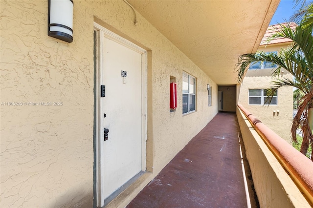 10772 La Placida Dr Unit 7-203, Coral Springs, FL 33065 - doorway to property with stucco siding