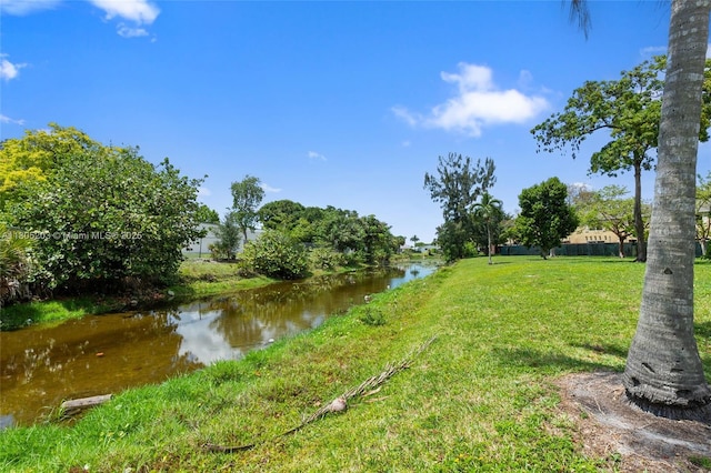 10772 La Placida Dr Unit 7-203, Coral Springs, FL 33065 - view of grassy yard featuring a water view