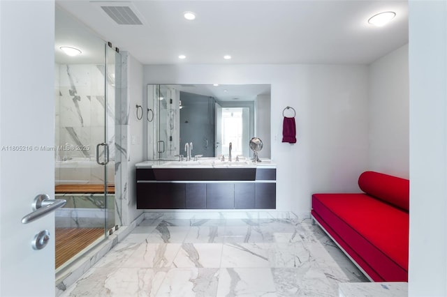 bathroom with double vanity, recessed lighting, a marble finish shower, and marble finish flooring