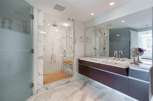 full bath with marble finish floors, a marble finish shower, recessed lighting, and double vanity