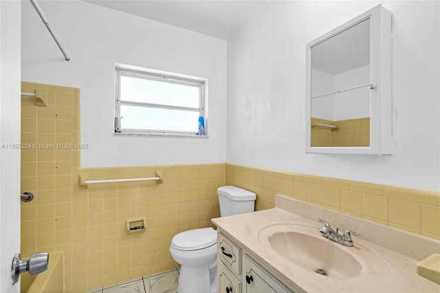 7612 NW 68th Ave, Tamarac, FL 33321 - bathroom with tile walls, a wainscoted wall, toilet, vanity, and marble finish floors