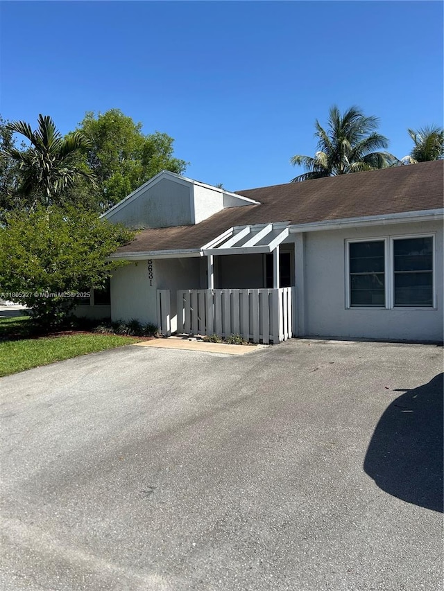 8631 Bridle Path Ct, Davie, FL 33328 - view of property exterior with stucco siding