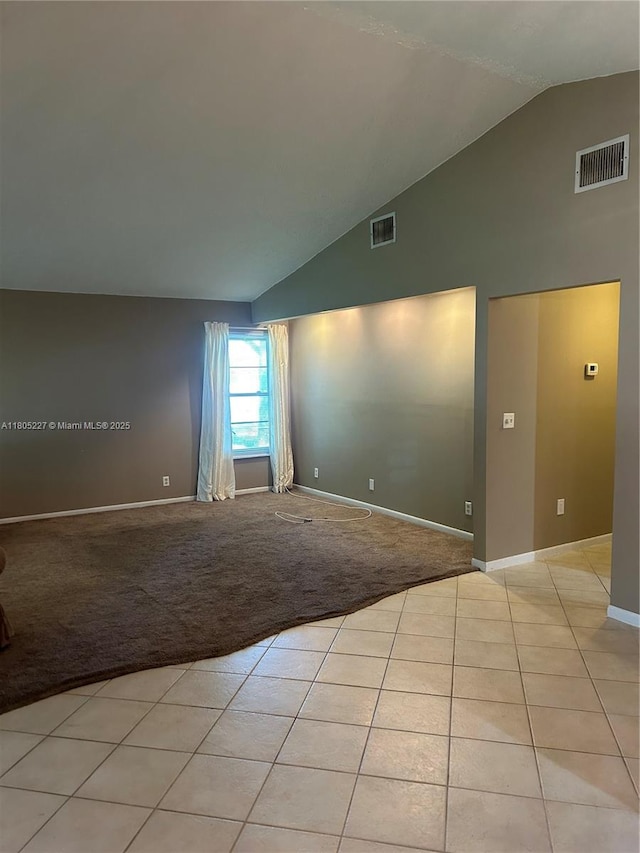 8631 Bridle Path Ct, Davie, FL 33328 - spare room with high vaulted ceiling, baseboards, light carpet, and light tile patterned flooring