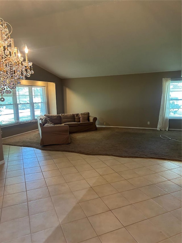 8631 Bridle Path Ct, Davie, FL 33328 - living area featuring light carpet, a chandelier, vaulted ceiling, light tile patterned flooring, and baseboards