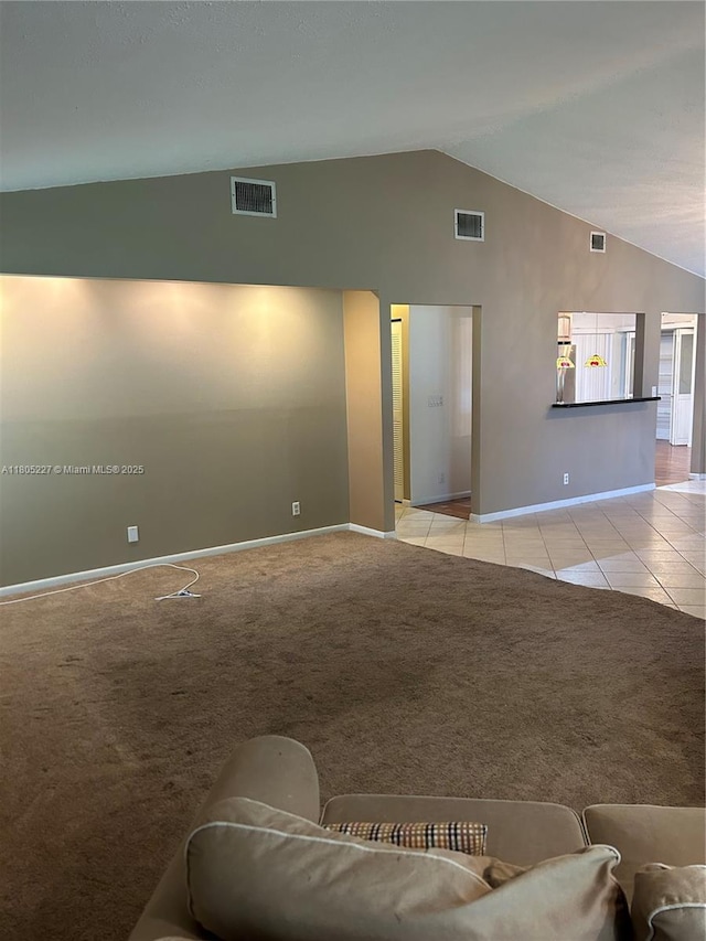 8631 Bridle Path Ct, Davie, FL 33328 - living room featuring baseboards, light colored carpet, light tile patterned floors, and high vaulted ceiling