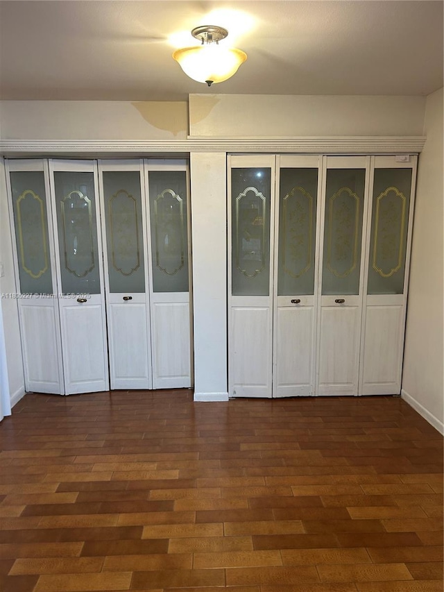 8631 Bridle Path Ct, Davie, FL 33328 - unfurnished bedroom with dark wood-style flooring and baseboards