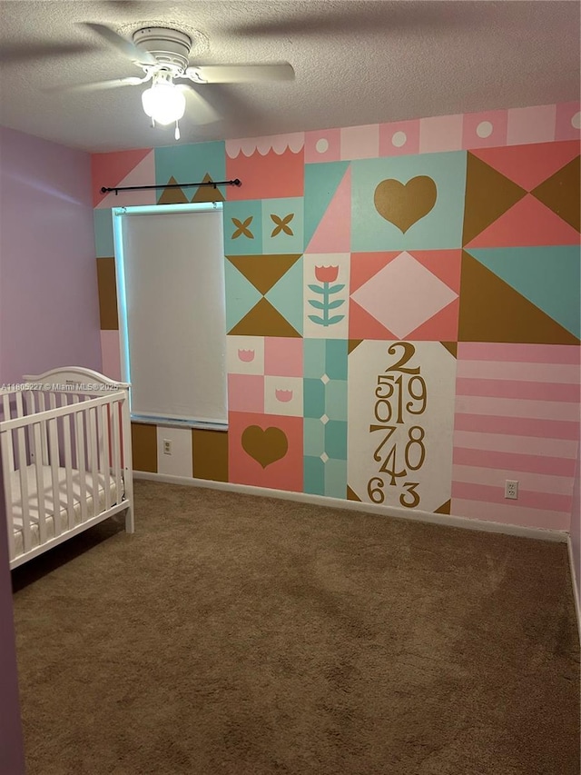 8631 Bridle Path Ct, Davie, FL 33328 - unfurnished bedroom with a textured ceiling, carpet, a nursery area, and a ceiling fan