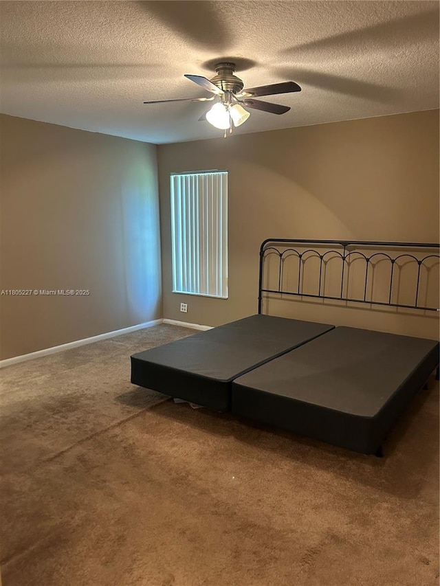 8631 Bridle Path Ct, Davie, FL 33328 - unfurnished bedroom with carpet floors, a textured ceiling, baseboards, and ceiling fan