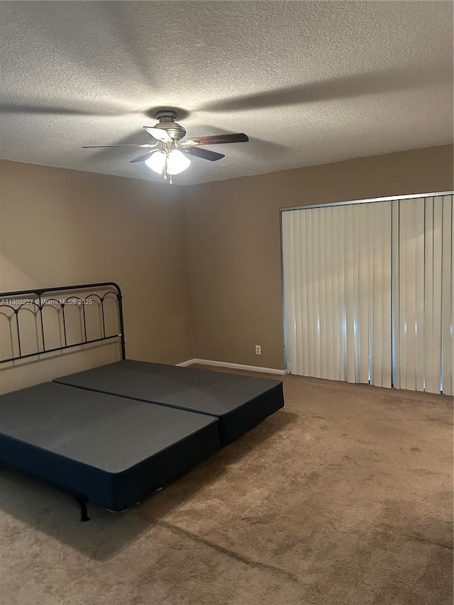 8631 Bridle Path Ct, Davie, FL 33328 - bedroom featuring carpet floors, a textured ceiling, and ceiling fan