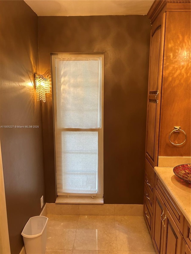 8631 Bridle Path Ct, Davie, FL 33328 - bathroom with tile patterned floors and vanity