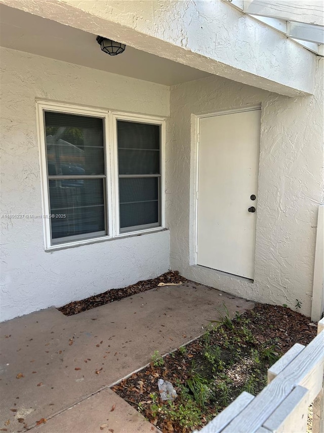 8631 Bridle Path Ct, Davie, FL 33328 - doorway to property with stucco siding