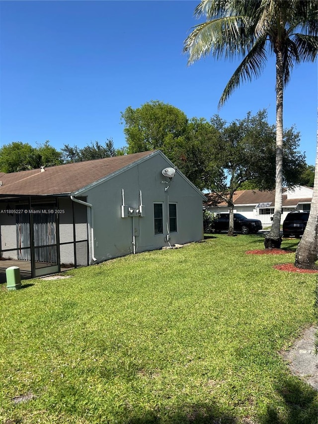 8631 Bridle Path Ct, Davie, FL 33328 - view of side of home featuring a yard and stucco siding