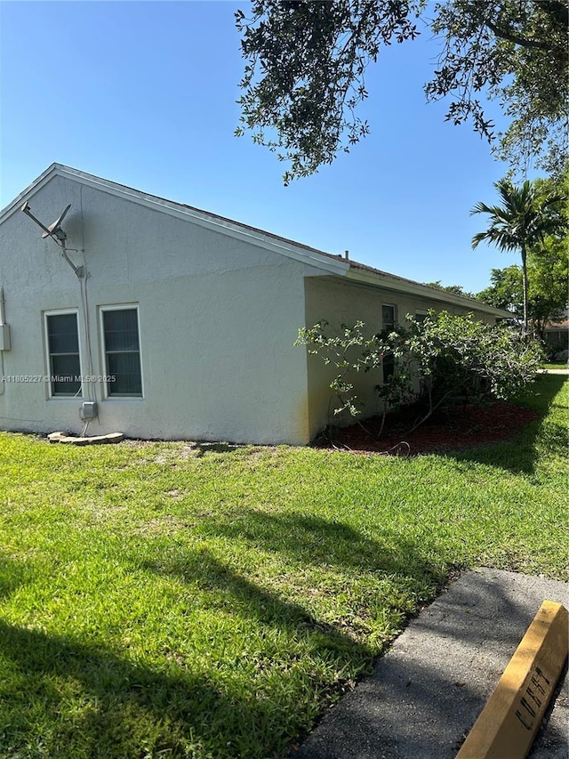 8631 Bridle Path Ct, Davie, FL 33328 - view of home's exterior with a yard and stucco siding
