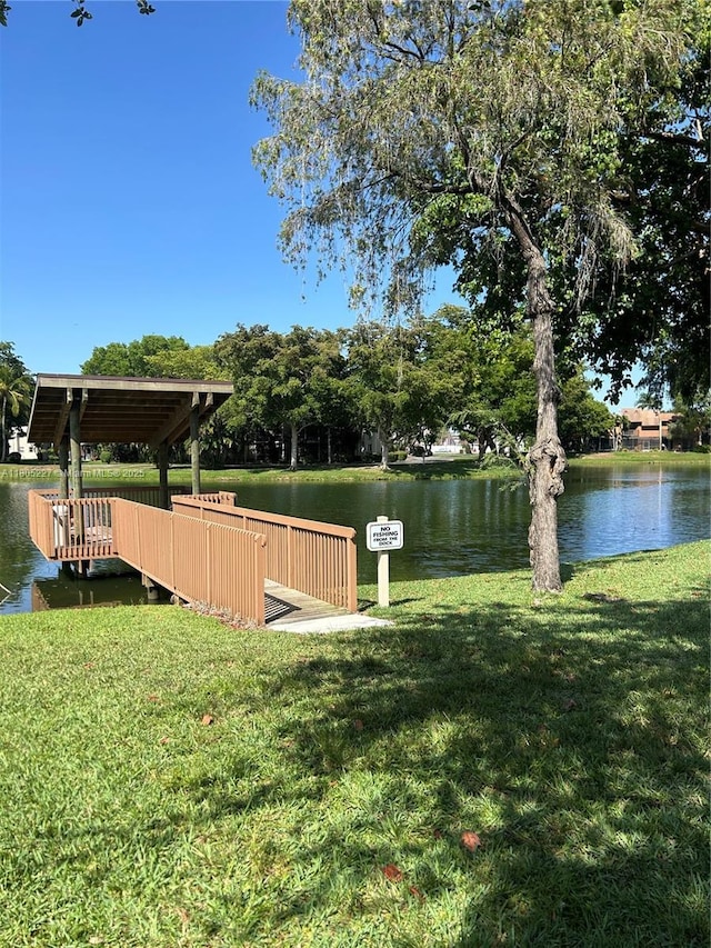 8631 Bridle Path Ct, Davie, FL 33328 - view of green lawn featuring a water view