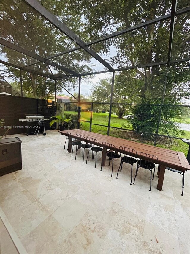 3480 Torremolinos Ave Unit A-33, Doral, FL 33178 - view of patio with outdoor dining area, glass enclosure, and a grill