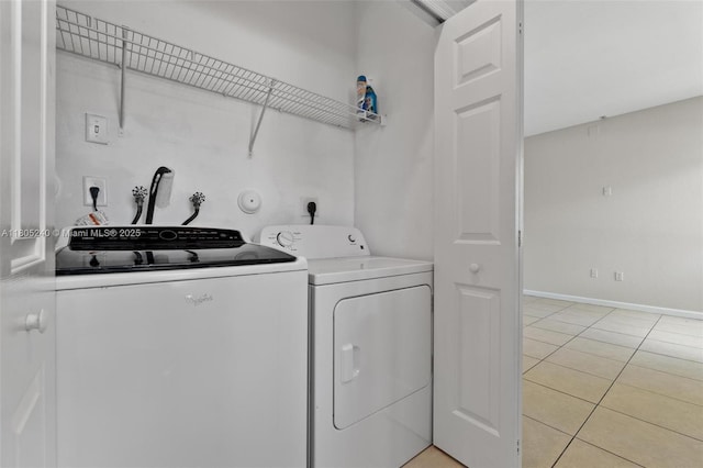1458 SE 24th Ct Unit 353, Homestead, FL 33035 - washroom with washer and clothes dryer, light tile patterned floors, and baseboards