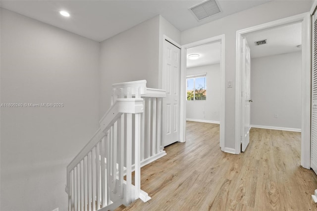 1458 SE 24th Ct Unit 353, Homestead, FL 33035 - corridor featuring an upstairs landing, light wood-style flooring, baseboards, and recessed lighting