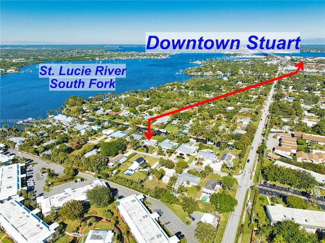 aerial view of property's location featuring a large body of water