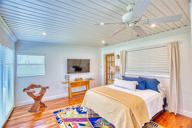 bedroom featuring crown molding, light wood finished floors, baseboards, ceiling fan, and recessed lighting