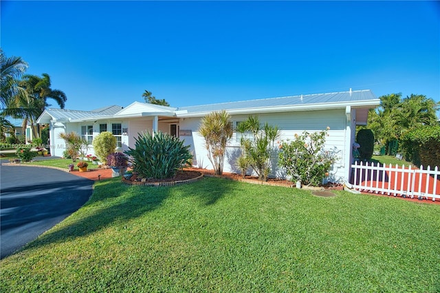 ranch-style home with metal roof