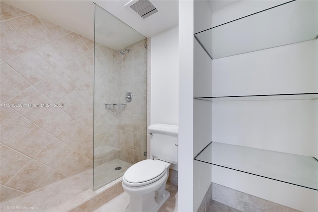 bathroom with toilet and a walk in shower