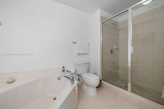 9021 SW 94th St Unit 306, Miami, FL 33176 - bathroom with tile patterned flooring, toilet, a stall shower, and a garden tub