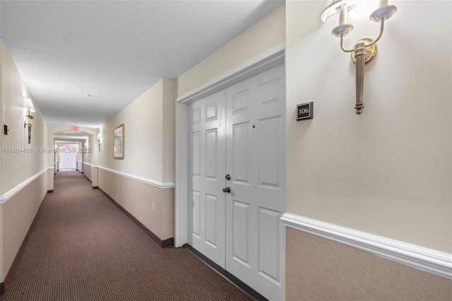9021 SW 94th St Unit 306, Miami, FL 33176 - corridor with dark carpet and arched walkways