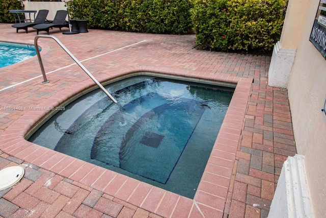 9021 SW 94th St Unit 306, Miami, FL 33176 - view of pool featuring a pool, an in-ground hot tub, and a patio