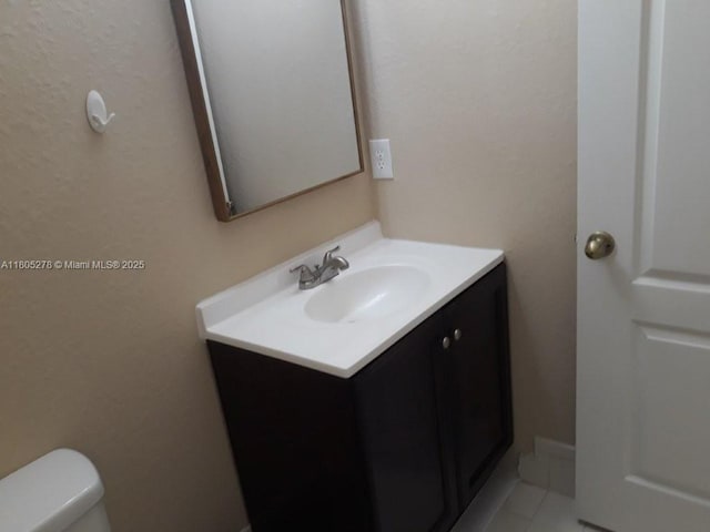 2731 SE 17th Ave Unit 207, Homestead, FL 33035 - bathroom with vanity, toilet, and tile patterned floors