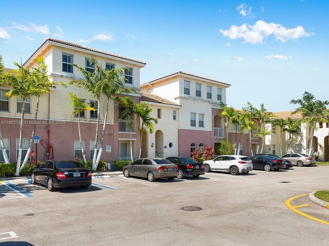 10022 NW 7th St Unit 206, Miami, FL 33172 - view of building exterior with uncovered parking