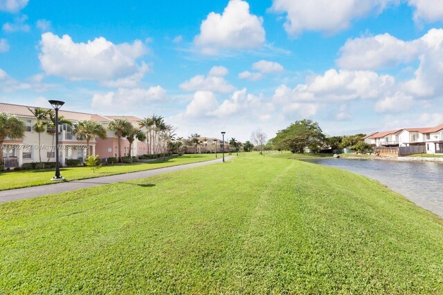 10022 NW 7th St Unit 206, Miami, FL 33172 - view of green lawn featuring a residential view and a water view