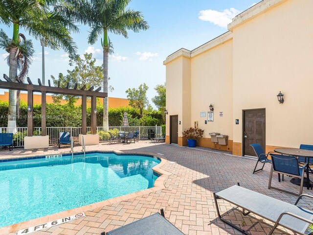 10022 NW 7th St Unit 206, Miami, FL 33172 - community pool featuring fence and a patio