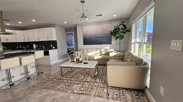 4651 SW 19th St, Fort Lauderdale, FL 33317 - living room with recessed lighting, a chandelier, and baseboards
