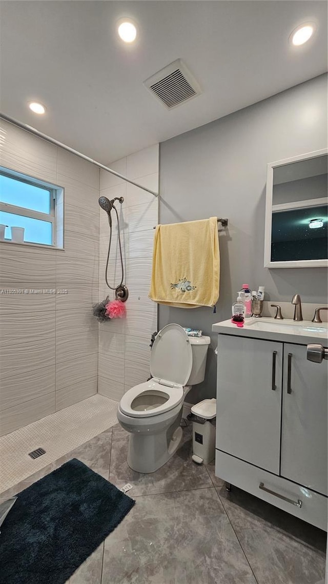 4651 SW 19th St, Fort Lauderdale, FL 33317 - bathroom with toilet, a tile shower, vanity, and recessed lighting