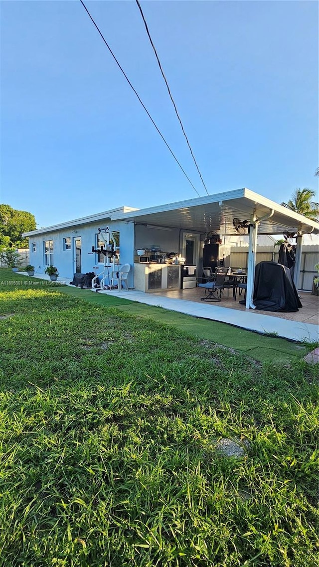 4651 SW 19th St, Fort Lauderdale, FL 33317 - back of property with a patio and stucco siding