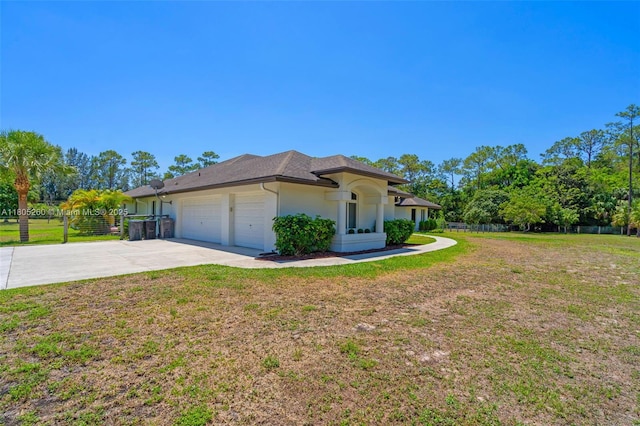 view of property exterior featuring a garage, driveway, and stucco siding