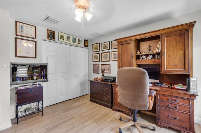 office area with ceiling fan and light wood-type flooring